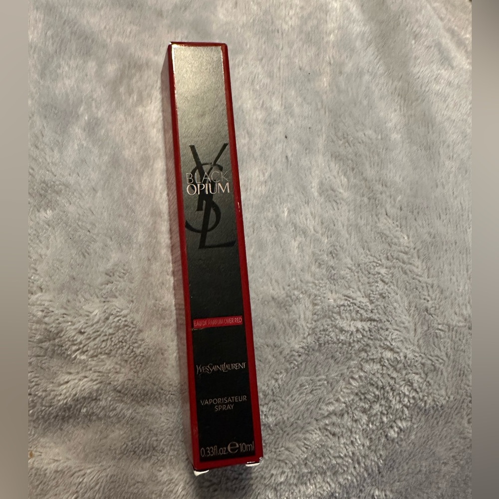 Yves Saint Laurent Black Opium EDP over red